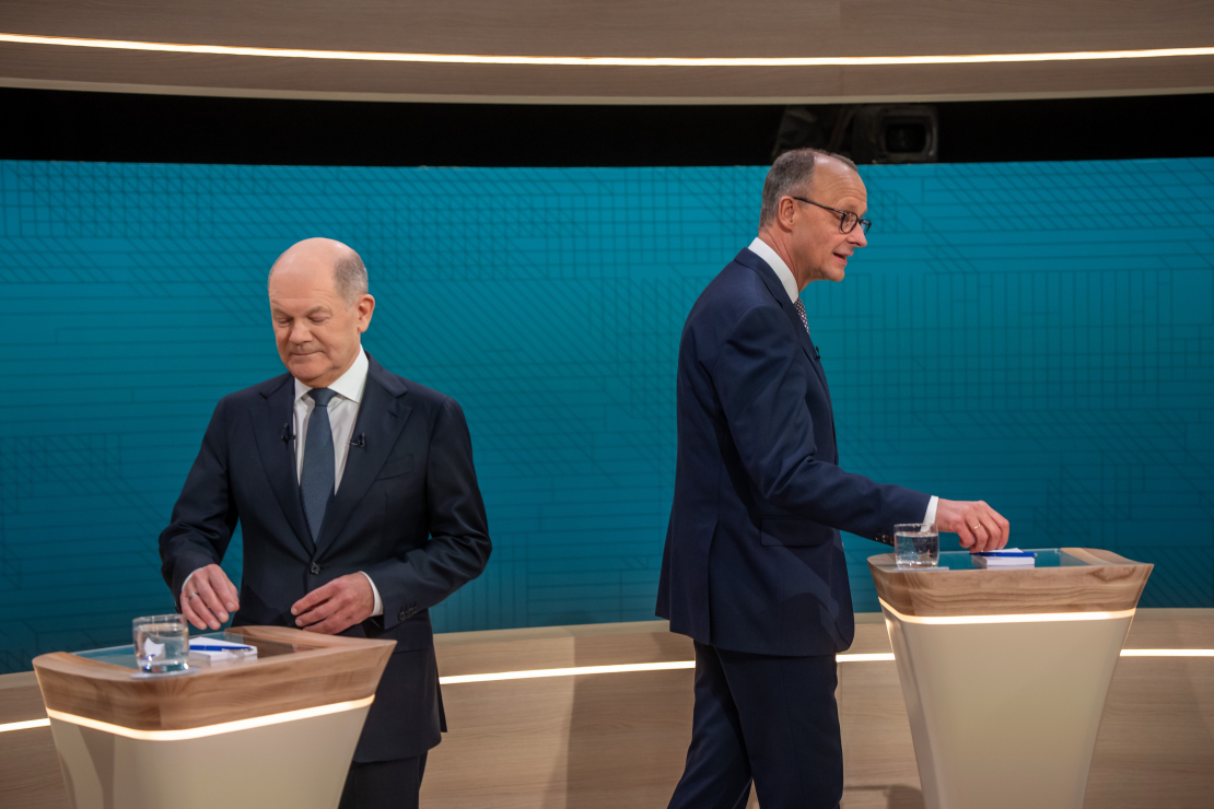 Debates. Šolcs un Mercs.