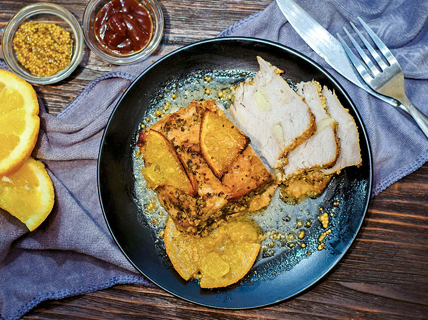 Cūkas cepetis apelsīnu mērcē.