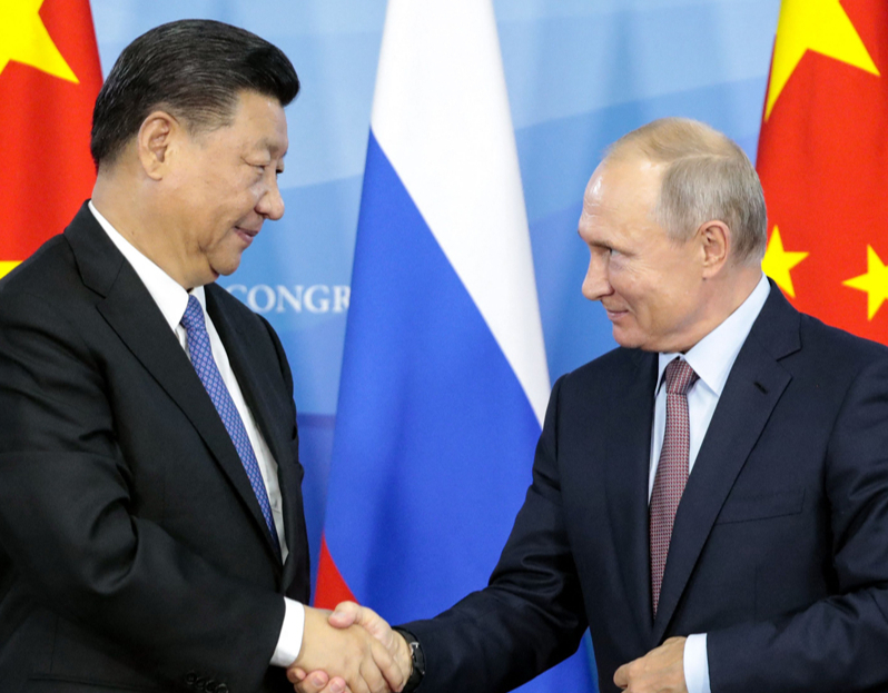 Sji Dzjiņpins un V. Putins